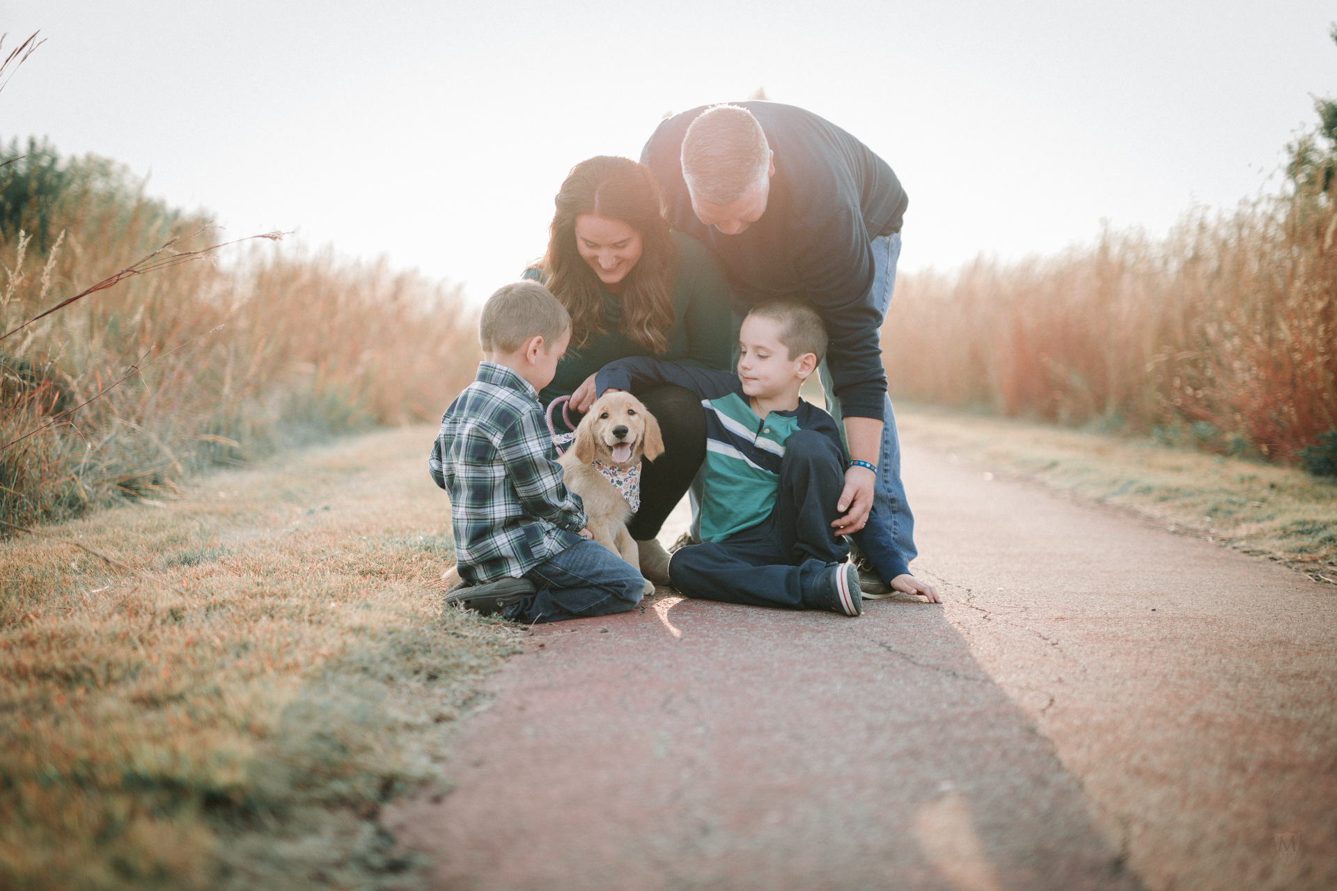 Danaise and her family with their golden retriever puppy